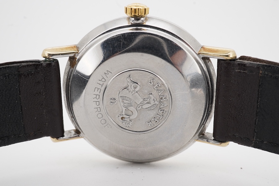 A gentleman's 1960's? steel and gold plated Omega Seamaster De Ville automatic wrist watch, with baton numerals, case diameter 35mm, on an associated leather strap, no box or papers.